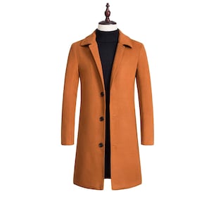 May include: A long-sleeved, single-breasted coat in a warm orange color. The coat has a classic collar and five buttons down the front.