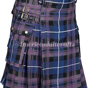 May include: A purple and blue tartan kilt with a large cargo pocket on the front. The kilt has a buckle closure and is made of a woven fabric.