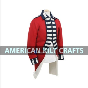 May include: A red military jacket with blue and white trim. The jacket has a long tail and is made of wool. The jacket is on a mannequin. The text "AMERICAN KILTCRAFTS" is visible on the image.