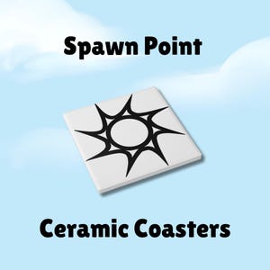 May include: White ceramic coaster with a black sunburst design and the text "Spawn Point". The words "Ceramic Coasters" are also displayed. The coaster is square and appears to be made of ceramic.