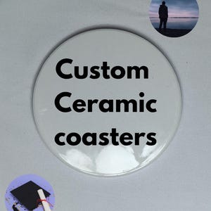 May include: White ceramic coaster with the text "Custom Ceramic Coasters" in black lettering.