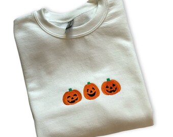 Halloween Embroidered Crewneck Sweatshirt featuring a Pumpkin Jack-o-Lantern design. Great for the fall Spooky Season Perfect Gift  for Her