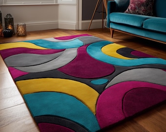 May include: A colorful area rug with an abstract design. The rug features curved shapes in teal, yellow, gray, purple, and black. The rug is rectangular and sits on a wooden floor.