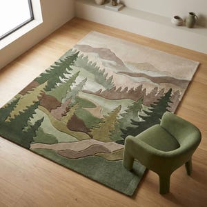 May include: A rectangular area rug with a forest landscape design in shades of green, brown, and beige. The rug features stylized trees and rolling hills. A green, rounded chair sits on the wooden floor next to the rug.