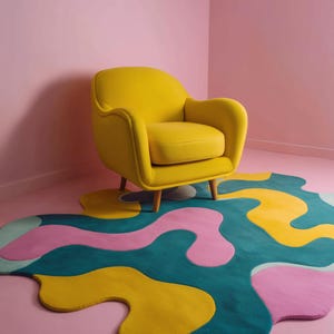Colorful abstract hand-tufted rug with wavy edges placed under a bright yellow armchair in a modern living room.