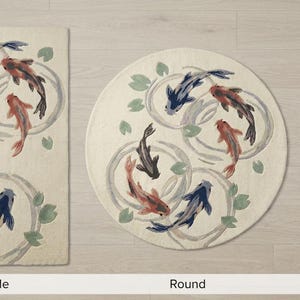 May include: Carpets in rectangle, round, and runner shapes, featuring a koi fish design. The fish are in shades of red, black, and blue, swimming in a water lily pond design. The carpets have a cream-colored background.