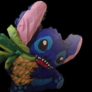 Stitch holding a pineapple piñata, colorful and fun for any occasion.