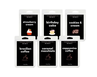 May include: Six wax melts in clear plastic containers with black labels. The scents are: strawberry cream, birthday cake, cookies & cream, brazilian coffee, caramel macchiato, and cappuccino coffee. Each container is 2.5 oz (70g).