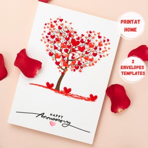 May include: Printable card with a red heart-shaped tree with the text "Happy Anniversary" and two pink hearts. The card is surrounded by red rose petals. The text "Print at Home" and "2 Envelopes Templates" is also included.