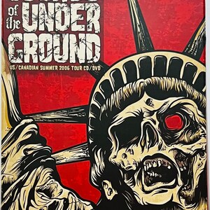 May include: A red, white, and blue CD/DVD cover with the text "Sounds of the Underground" and "US/Canadian Summer 2006 Tour CD/DVD". The cover features a black and white illustration of a zombie Statue of Liberty.
