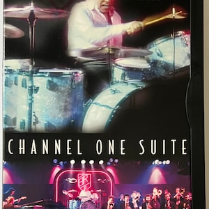 May include: DVD cover featuring Buddy Rich and His Band performing a Channel One Suite. The cover features a black and white photo of Buddy Rich playing drums, and a color photo of the band performing on stage.