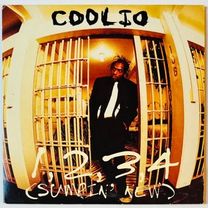 May include: A black and white album cover with the title "1, 2, 3, 4 (Sumthin' New)" and the artist's name "Coolio" in large, bold letters. The cover features a photo of a man in a black suit and tie standing in a jail cell.