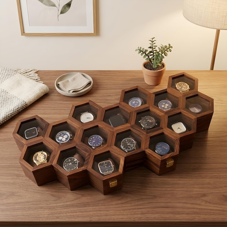 May include: A wooden watch display case featuring a honeycomb structure with multiple hexagonal compartments. Each compartment has a clear glass lid and contains a wristwatch. The case is crafted from dark brown wood with gold-tone metal latches.