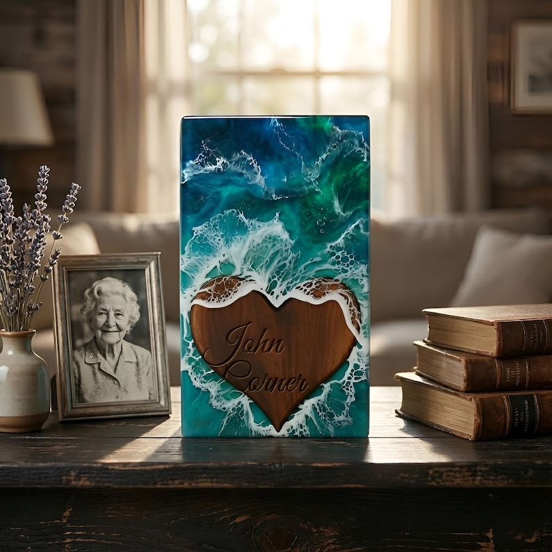 a handmade wooden cremation urn for human and pet ashes is kept on a wooden shelf with a photo frame of a old men and some books.