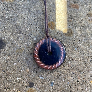Orgonite pendant with tensor ring