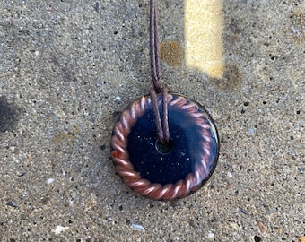 Orgonite pendant with tensor ring