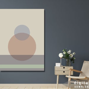 Puede incluir: Impresión de arte abstracto con círculos superpuestos en tonos beige, marrón y gris sobre un fondo crema. Los círculos se superponen a un patrón de rayas horizontales en tonos de verde y gris.