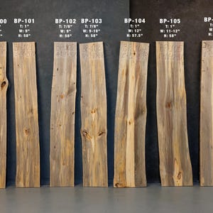May include: A collection of seven weathered wooden planks, each with unique grain patterns and natural imperfections. The planks vary in width and height, with the tallest measuring 58 inches. The text "BP-100" through "BP-106" is visible, along with dimensions.