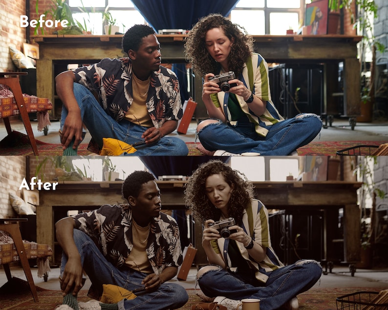 May include: Two people are sitting on the floor, one holding a camera. The person on the left is wearing a black and white patterned shirt and blue jeans. The person on the right is wearing a striped shirt and ripped blue jeans. A vintage camera is in focus.