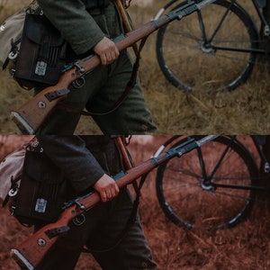 May include: A split image showing a person holding a rifle and a bicycle in the background. The top image is in color and the bottom image is in sepia tone.