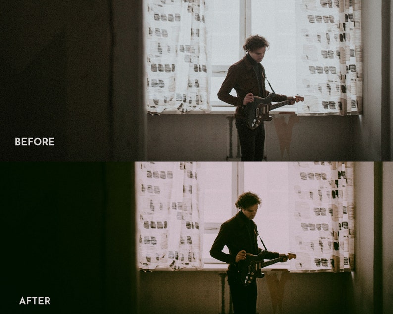 May include: A person standing in a room with a window and curtains, holding a black electric guitar. The person is wearing a brown jacket and black pants.