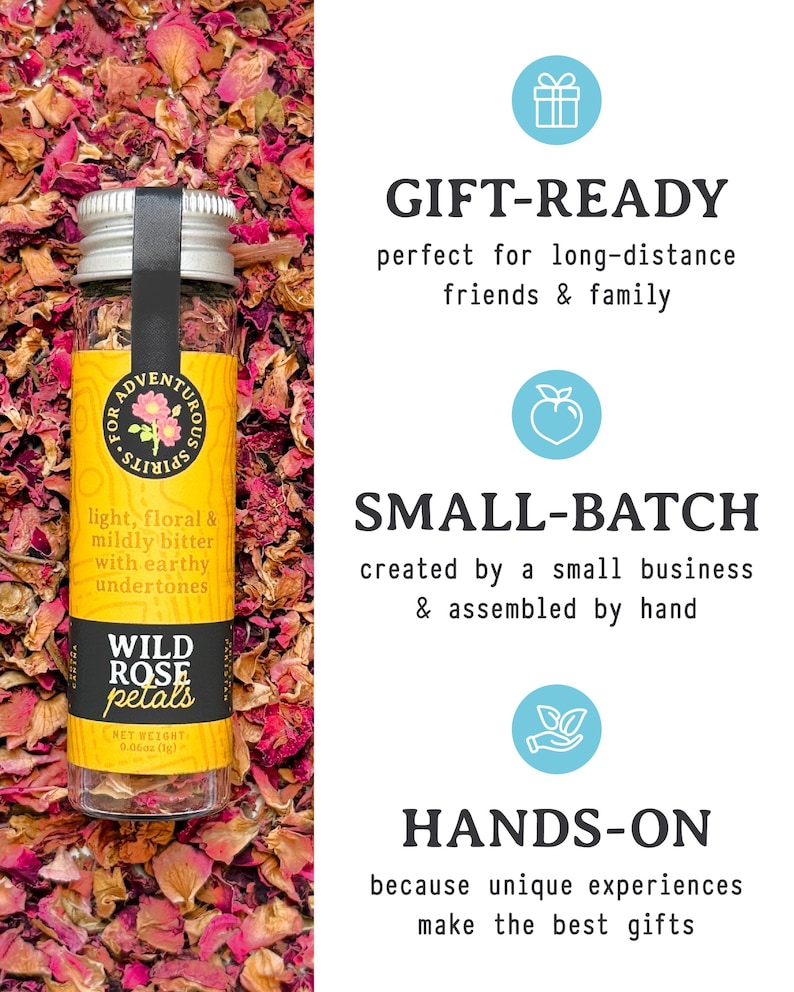May include: A glass jar of wild rose petals with a silver lid and a black label. The label reads "Wild Rose Petals" and "light, floral & mildly bitter with earthy undertones." The jar is surrounded by dried rose petals. The text "Gift-Ready", "Small-Batch", and "Hands-On" is also visible.