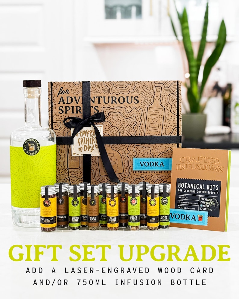 May include: A gift set featuring a clear glass bottle with a green label, a decorative box, and several small glass vials. The box is brown with a black ribbon and a tag that says "Happy Father's Day". The set includes a "Vodka" botanical infusion kit.