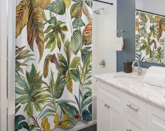 May include: A white shower curtain with a tropical leaf pattern in shades of green, yellow, and brown. The leaves are large and detailed, creating a lush and vibrant design.