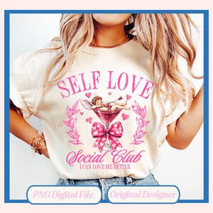 May include: A white t-shirt with the text "Self Love Social Club I Can Love Me Better" in pink lettering. A pink bow with hearts is above the text. A cartoon cupid is in a martini glass with hearts and arrows.