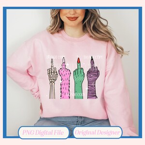 May include: A light pink sweatshirt featuring a graphic of four stylized middle fingers. The fingers are depicted as a skeleton hand, a furry pink hand, a green hand with a red nail, and a wrapped hand. The words "DO NOT COPY" are printed above the fingers.