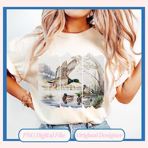 May include: A white t-shirt with a design of three ducks in a pond. The ducks are green, brown, and white. The design is surrounded by a watercolor background.
