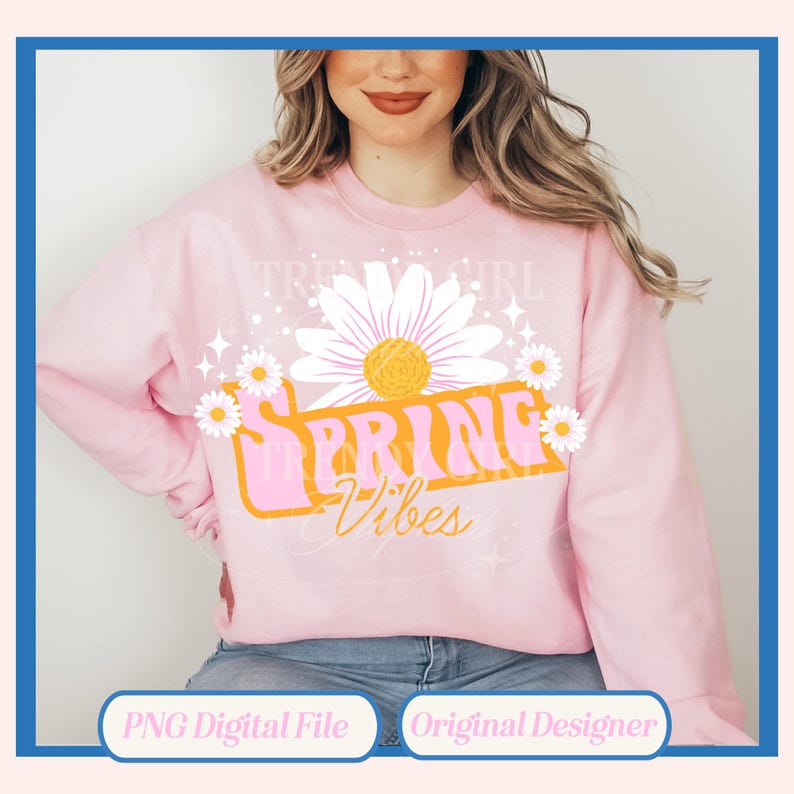 K&ouml;nnte beinhalten: Ein rosa Sweatshirt mit einem Grafikdesign einer G&auml;nsebl&uuml;mchenblume und dem Text "Spring Vibes" in einer Retro-Schrift.