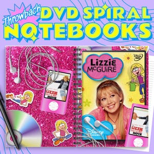 May include: A spiral notebook with a pink glitter cover featuring a "Lizzie McGuire" theme. The notebook includes a DVD, a pink media player, stickers, and the text "Throwback DVD Spiral Notebooks".