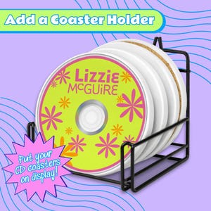 a CD coaster holder with a yellow and pink design, containing four white coasters.