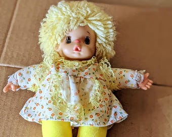 Vintage Greek El Greco 1980s Yellow Rag Doll, Plush Body, Plastic Head, Eyelashes, Pouf Yarn Hair, Lace Accents, Floral Dress