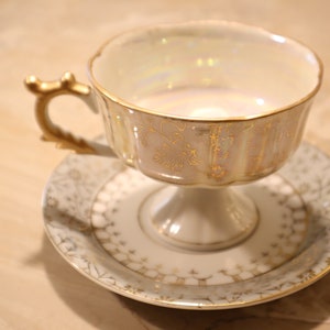 Vintage Japanese Porcelain Pedestal Teacup and Saucer Luster Center