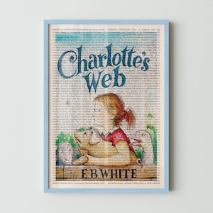 May include: A framed print of "Charlotte's Web" features the title in a large, stylized font. The image shows a girl with red hair and a pig, set against a backdrop of text. The author's name, E.B. White, is at the bottom.