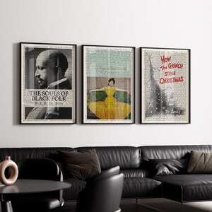 May include: Three framed art prints. The first features a portrait and the text "THE SOULS OF BLACK FOLK W.E.B. Du Bois." The second shows a woman in a yellow dress. The third has a Christmas tree illustration and the text "How The GRINCH STOLE CHRISTMAS by Dr. Seuss."