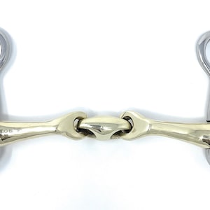 May include: A silver and gold horse bit with two rings on each side. The bit has a jointed mouthpiece.