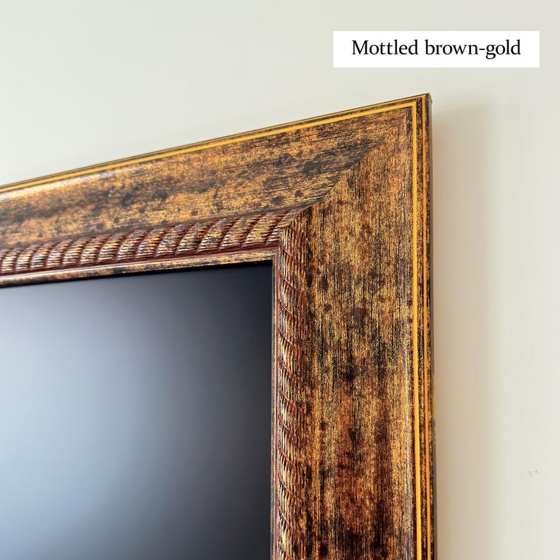 May include: Close-up of a rectangular frame with a mottled brown-gold finish. The frame has a decorative rope-like inner border and a gold outer edge. The text "Mottled brown-gold" is in the upper right corner.
