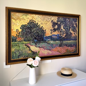 May include: A framed oil painting of a landscape with two large trees in the foreground and a small village in the background. The painting is done in a style reminiscent of Vincent van Gogh, with thick brushstrokes and vibrant colors.