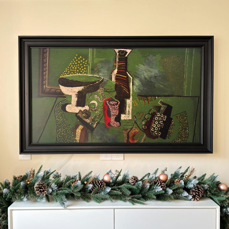 May include: A framed painting of a still life with a green background. The painting features a bottle, a bowl, a glass, and grapes. The painting is in a black frame.