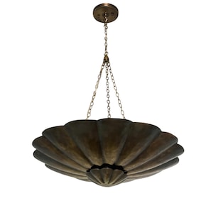May include: A bronze-colored, scalloped-edge pendant light fixture. The light hangs from a chain attached to a circular ceiling mount. The fixture has a decorative, flower-like center.