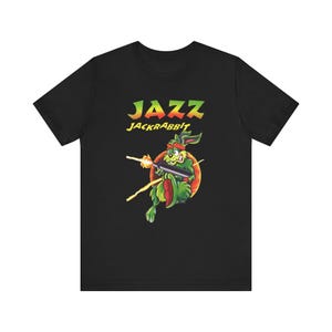 Jazz Jackrabbit PC DOS Estilo Retro Capa Arte Unissex Jersey Manga Curta Camiseta Ótimo Presente para Jogadores e Colecionadores