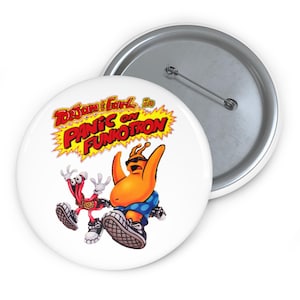 May include: White button badge featuring the text "ToeJam & Earl in Panic on Funkotron" with cartoon characters. The characters are orange and red with sunglasses and sneakers. The badge has a silver pin back.