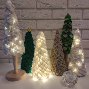 Christmas trees on the trunk illuminated wooden disc