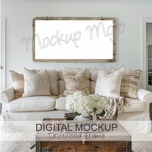 May include: A white couch with throw pillows and a blanket sits in front of a white wall with a rustic wood framed picture above it. The couch is in front of a coffee table with a white hydrangea bouquet on top. The text "DIGITAL MOCKUP Driftwood Frame" is at the bottom of the image.