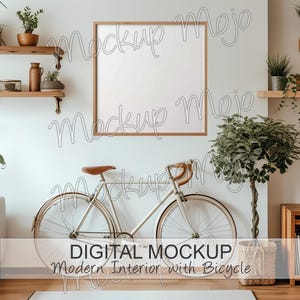 Puede incluir: Una bicicleta blanca con manillar y sillín de cuero marrón se apoya en una pared blanca en un interior moderno. Un cuadro enmarcado cuelga sobre la bicicleta. Una planta en maceta se encuentra en la esquina de la habitación. El texto "DIGITAL MOCKUP Modern Interior with Bicycle" está en la parte inferior de la imagen.