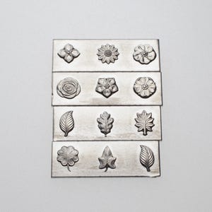 Gemina The Garden - Herramienta para hacer joyas con placa de acero de 12 disparos, troquel de impresión para joyeros, plateros y joyeros.