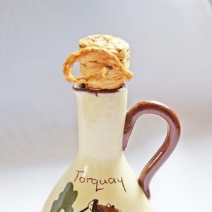 RARE FIND St. Marychurch Pottery Torquay  Vinegar Bottle  
Condition: As new.  Used for display only.  No chips, cracks or crazing.

Height: 14cms
Width: 8cms